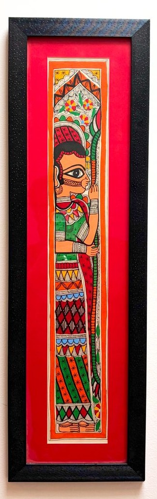 A single figure in profile in green, red and orange, with an ornate patterned border