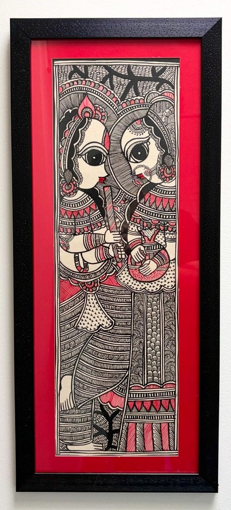 Two faces in fine black ink linework with red accents
