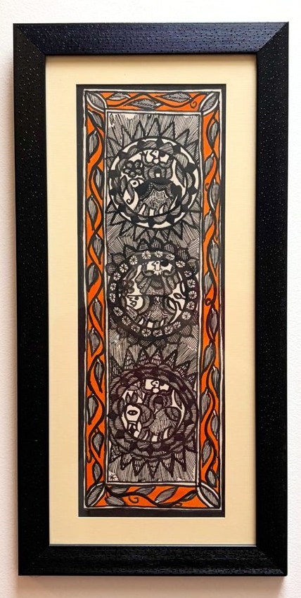 Three circular medallions in fine black ink linework with an orange braided border
